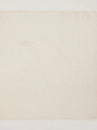 Cream cashmere neck scarf with fringed ends.