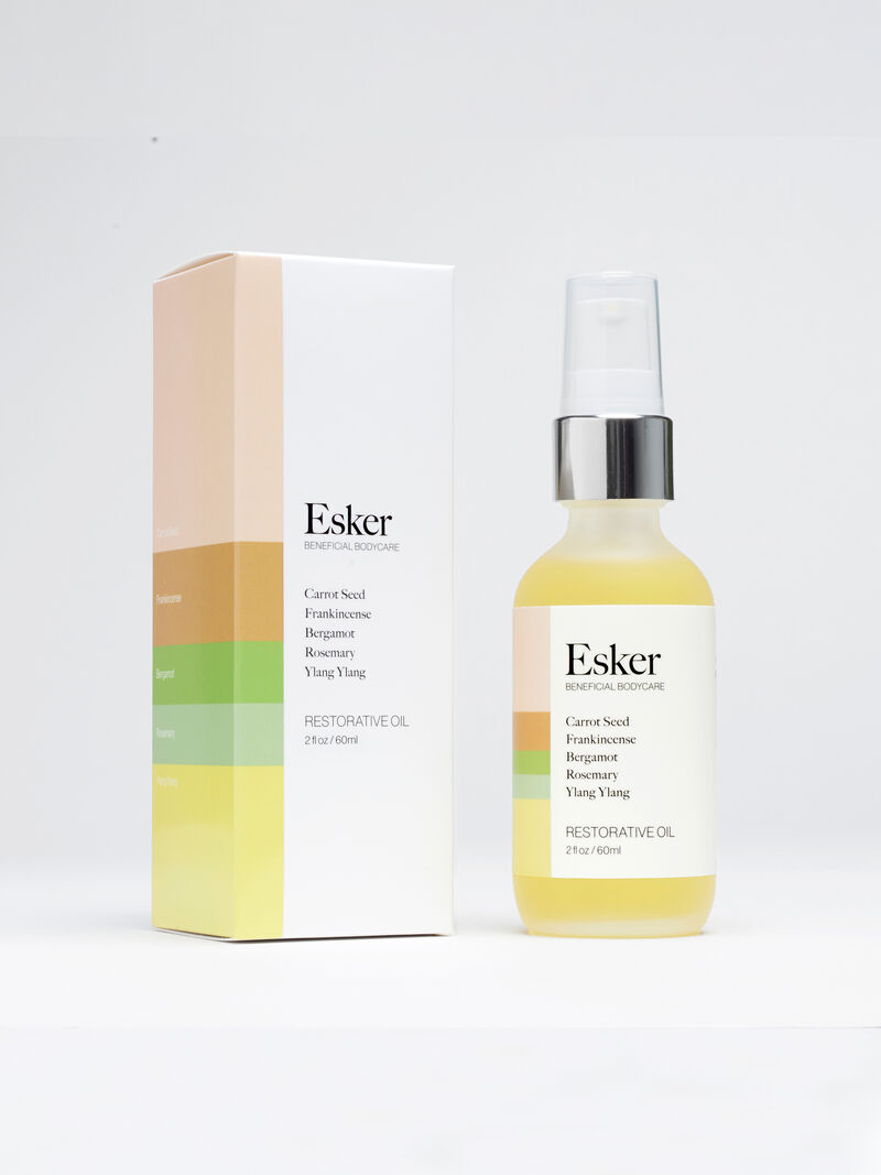 Woman Wears Esker - 2 Oz Restorative Body Oil image number 1