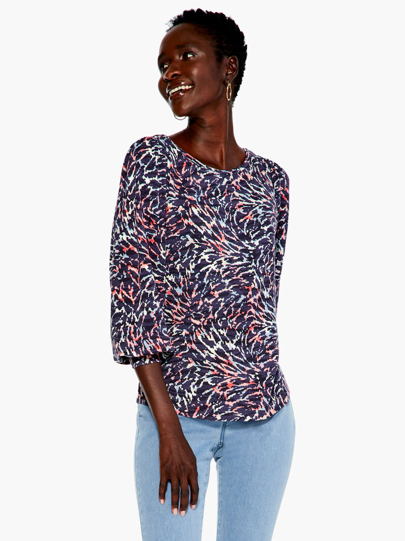 Woman Wears Glowing Sunset Top image number 1