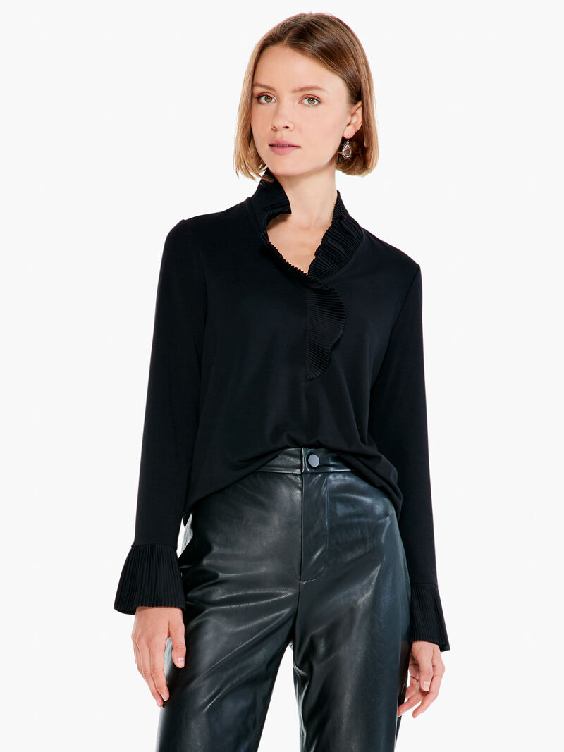 Woman Wears Ruffled Up Top image number 0