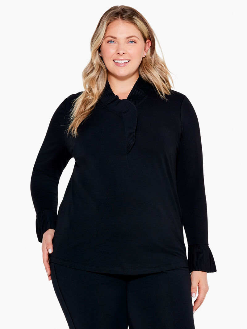 Woman Wears Ruffled Up Top image number 0
