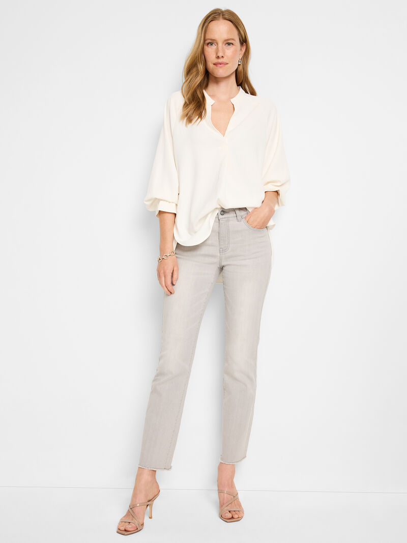 Woman Wears 28" Mid Rise Demi Boot Jeans image number 1