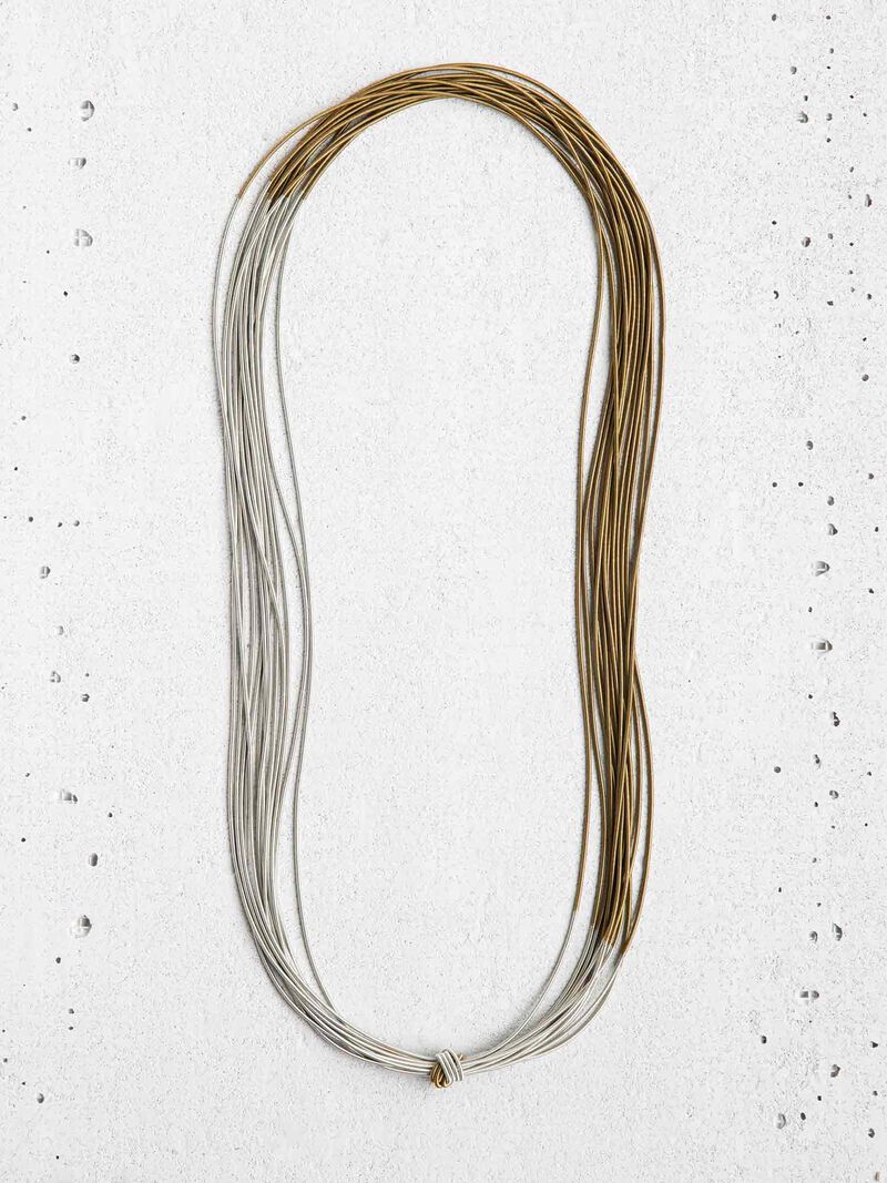 Woman Wears SEA LILY SILIVER/BRONZE TWO TONE KNOT NECKLACE image number 0