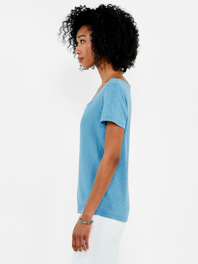 Woman Wears NZT Short Sleeve Knotted V-Neck Tee image number 1