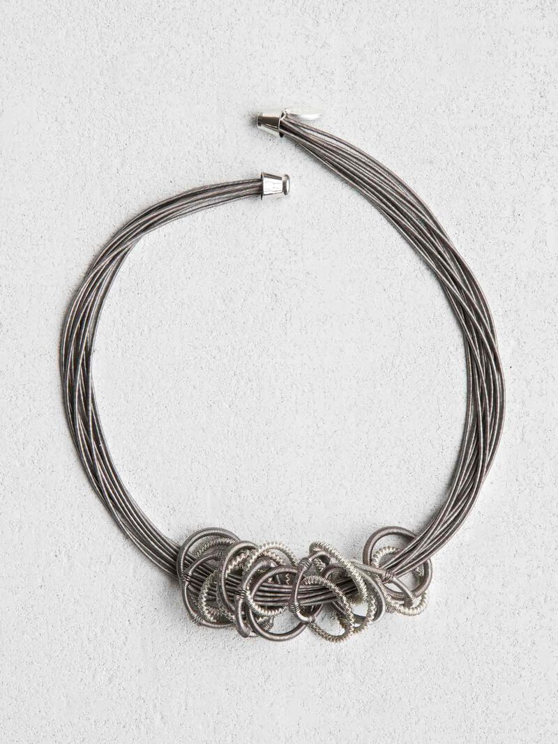 Woman Wears SEA LILY MULTI STRAND CHAIN OF RINGS NECKLACE image number 1