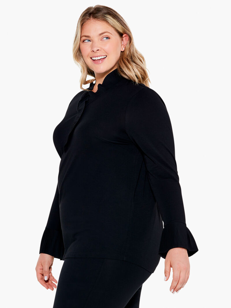 Woman Wears Ruffled Up Top image number 1