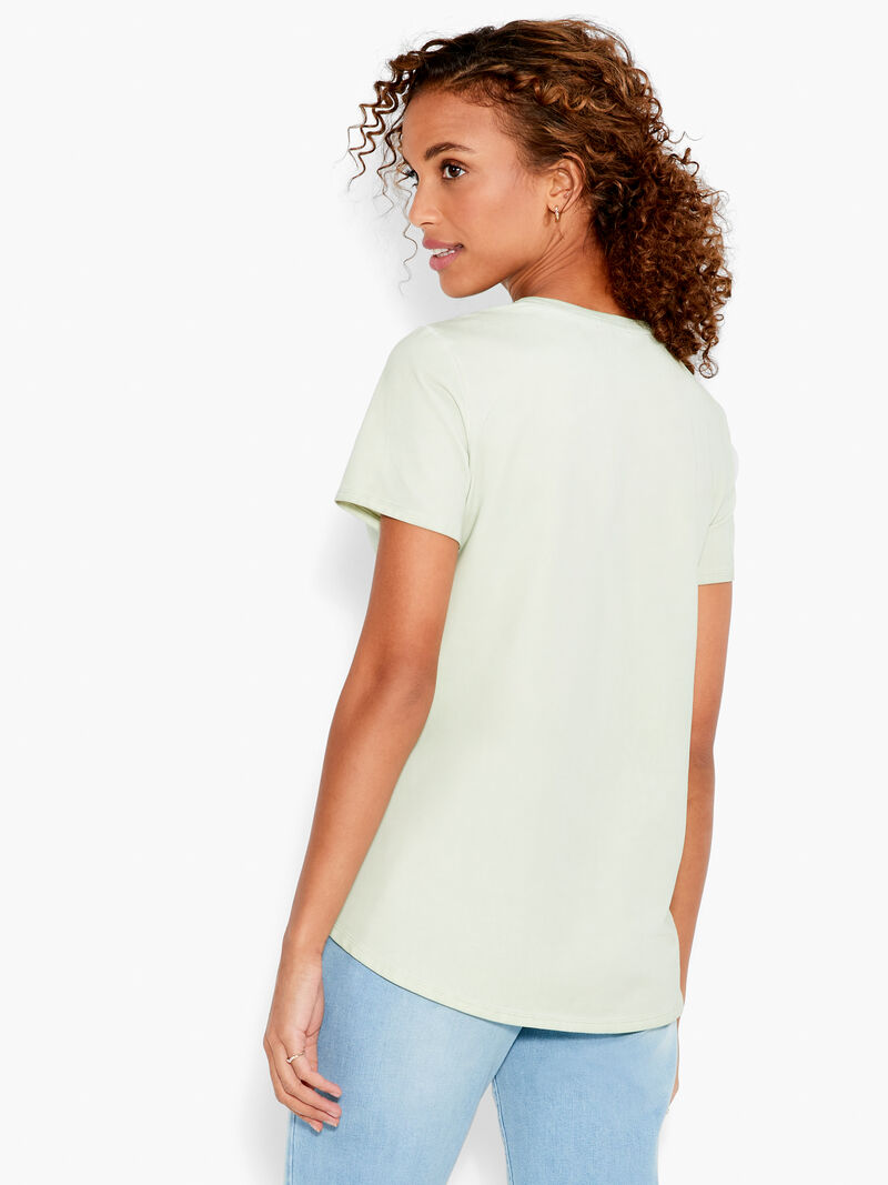 Woman Wears NZT Short Sleeve Shirt Tail Crew Neck Tee image number 2
