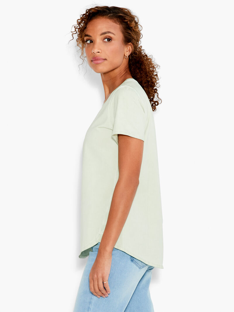 Woman Wears NZT Short Sleeve Shirt Tail Crew Tee image number 1