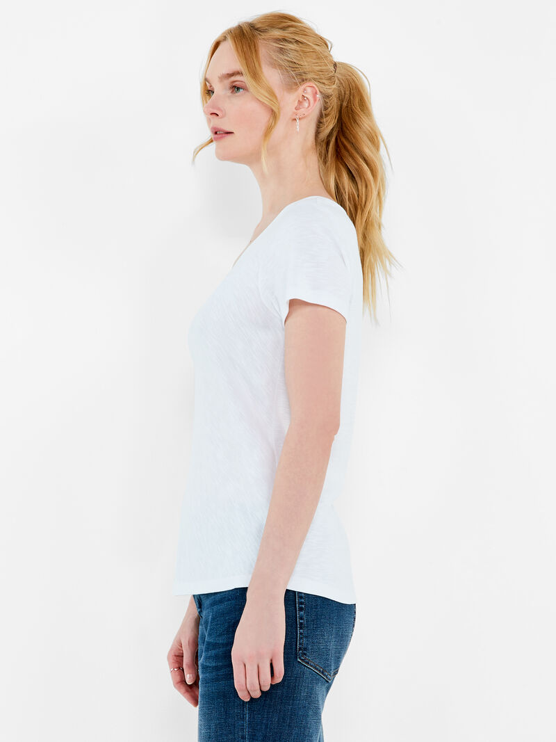 Woman Wears NZT Short Sleeve Knotted V-Neck Tee image number 1