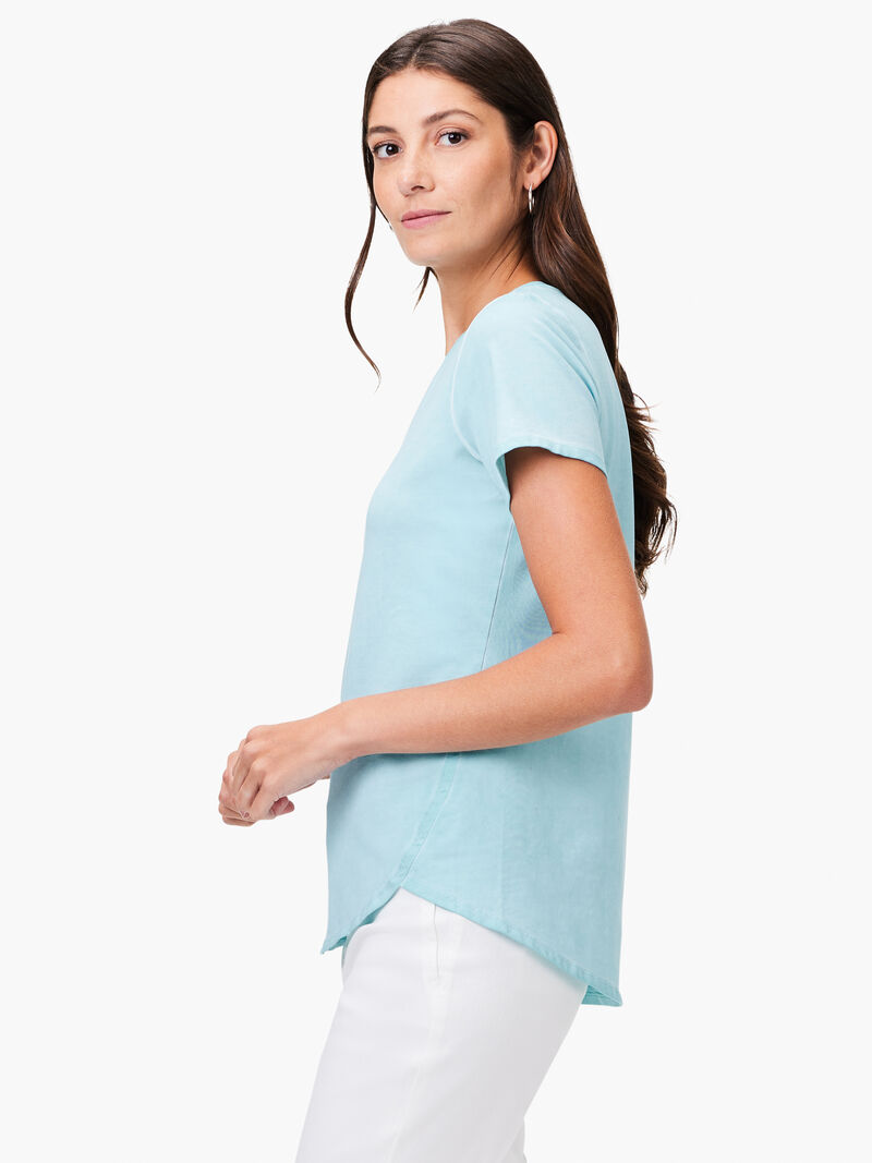 Woman Wears NZT Short Sleeve Shirt Tail Crew Tee image number 1