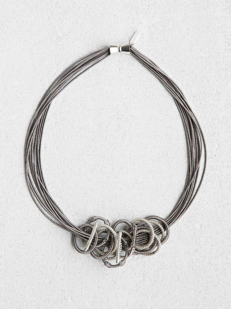Woman Wears SEA LILY MULTI STRAND CHAIN OF RINGS NECKLACE image number 0