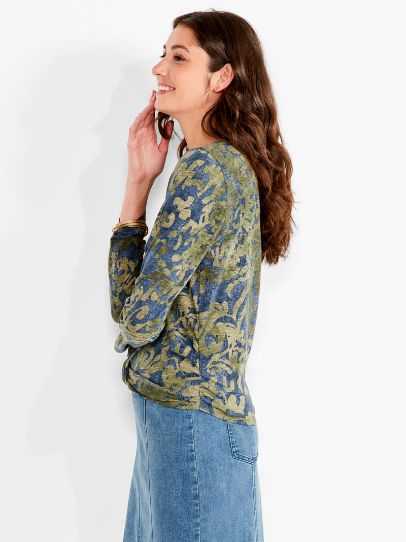 Woman Wears NZT Watercolor Camo Bracelet Sleeve Knot Front Tee image number 1