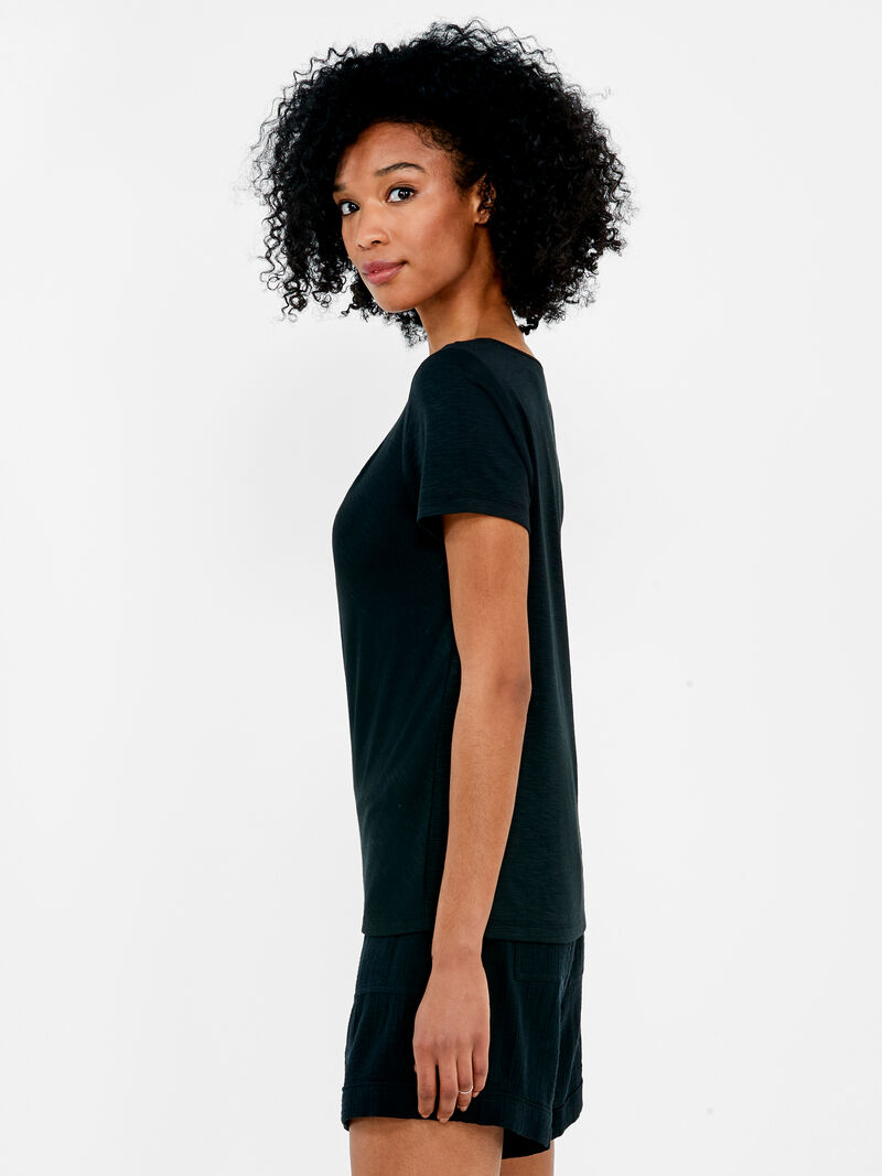 Woman Wears NZT Short Sleeve Knotted V-Neck Tee image number 1