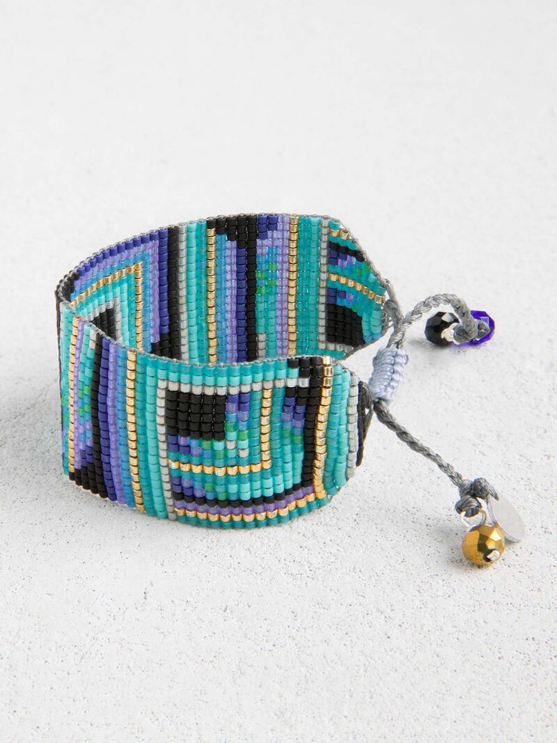 Woman Wears Mishky Turquoise Mosaic Print Beaded Bracelet image number 0