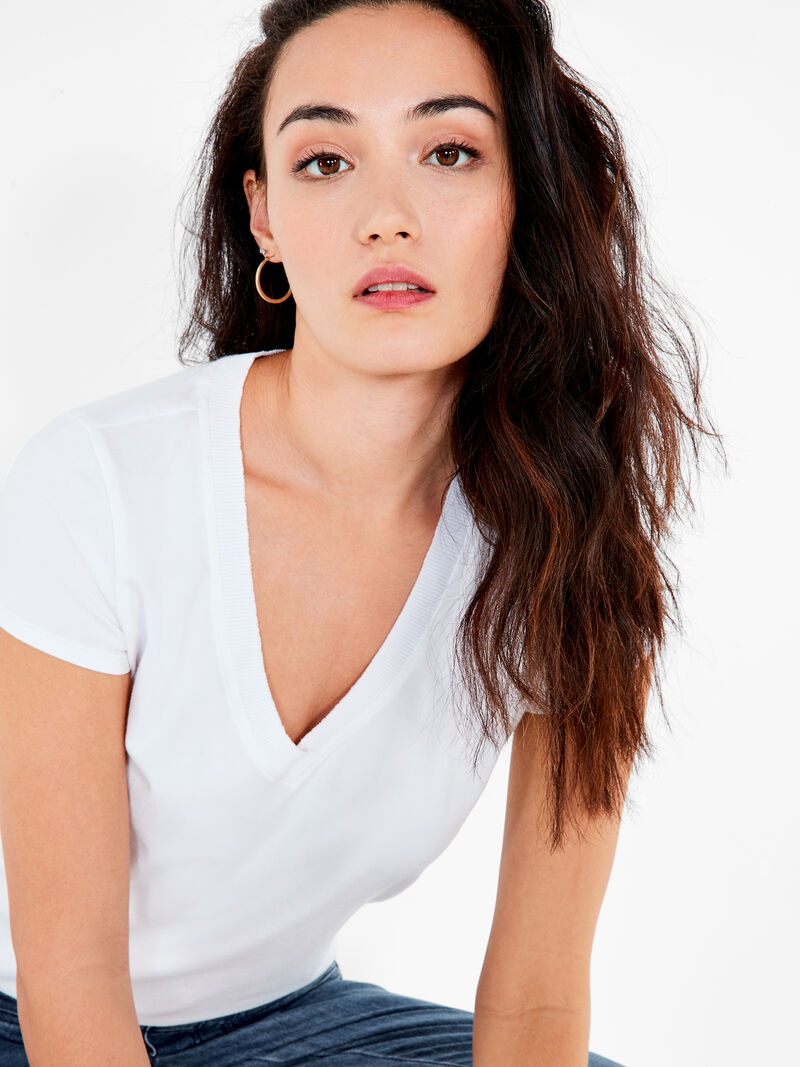 Woman Wears NZT Short Sleeve Rib Trim V Tee image number 0