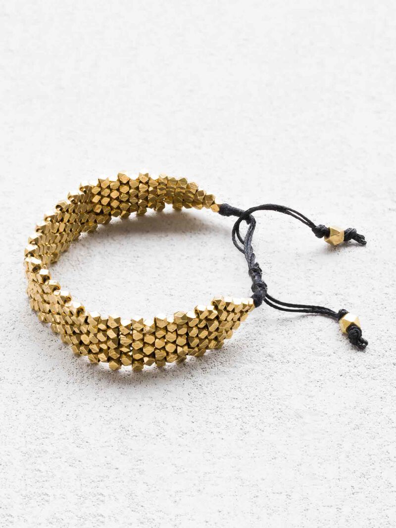 Woman Wears BAIZAAR ADJUSTABLE BRASS BEAD BRACELET image number 0